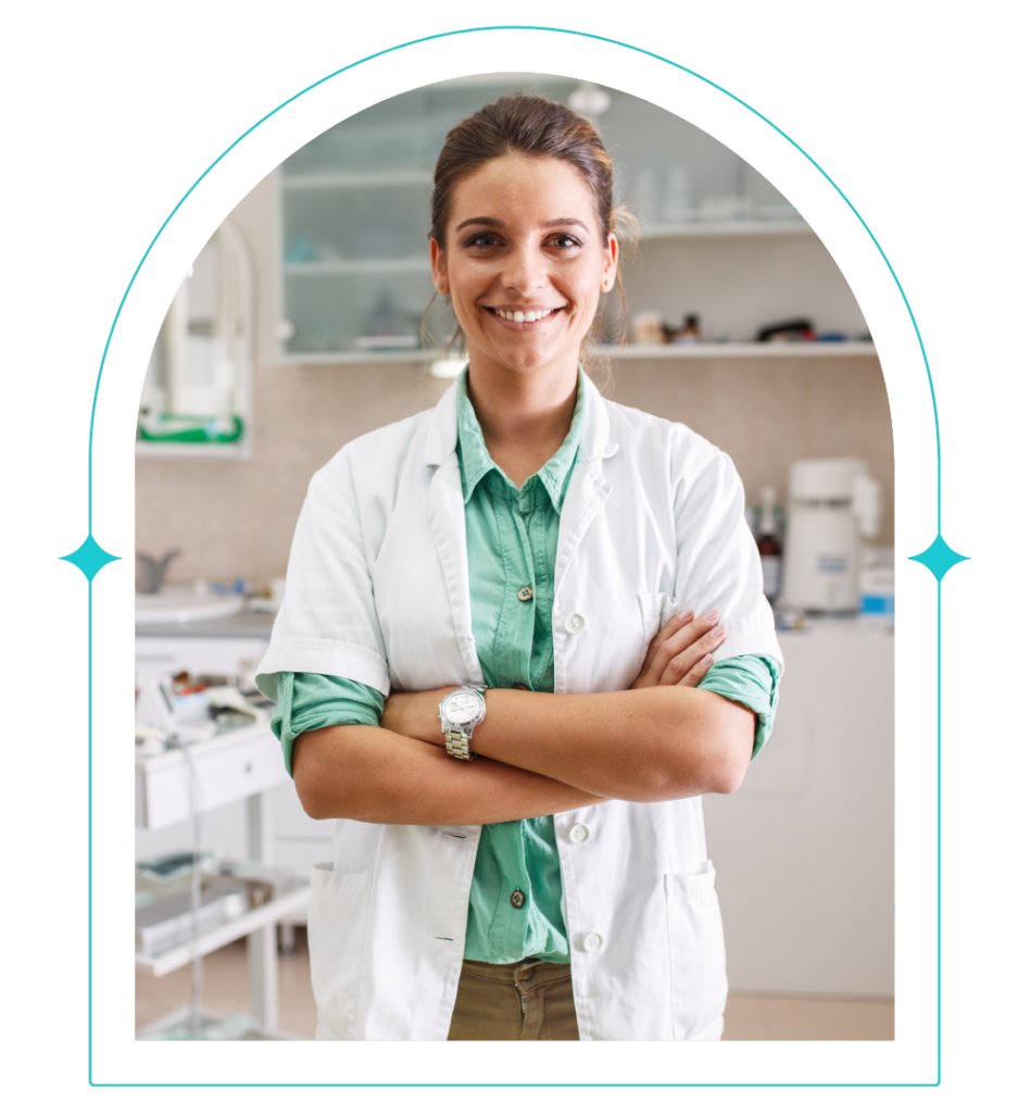 A female dentist from Clearly Dental Camden poses for a profile picture while wearing her gown