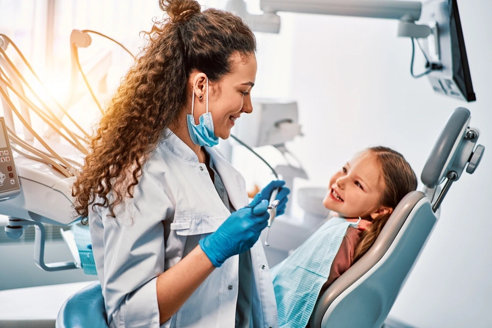 Clearly Dental Camden dentist talking to her kid patient